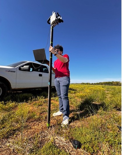Researcher operating the stereovision collection rig in the field